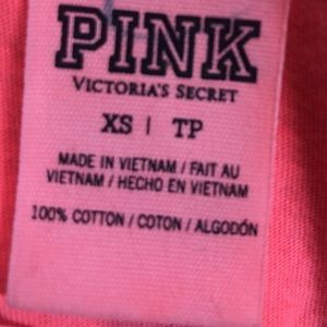 Pink shirt xs but fits a medium or large